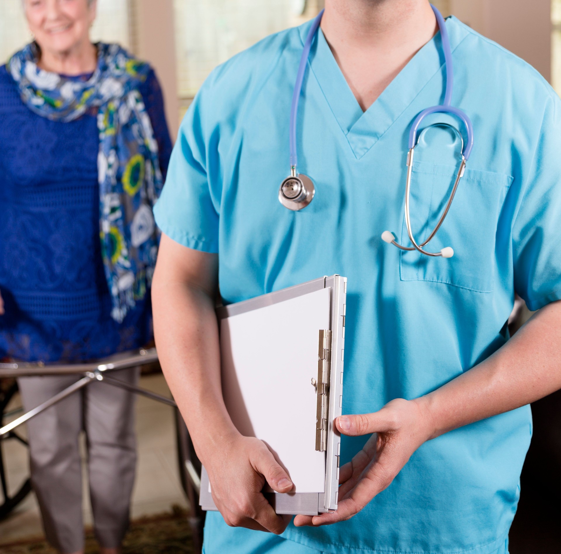 Healthcare: Concierge doctor with senior at house or nursing home.